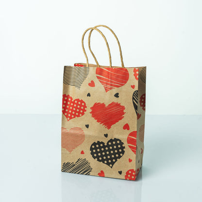 Sacs Kraft poignees torsadees motifs coeur L. 21 x 15cm