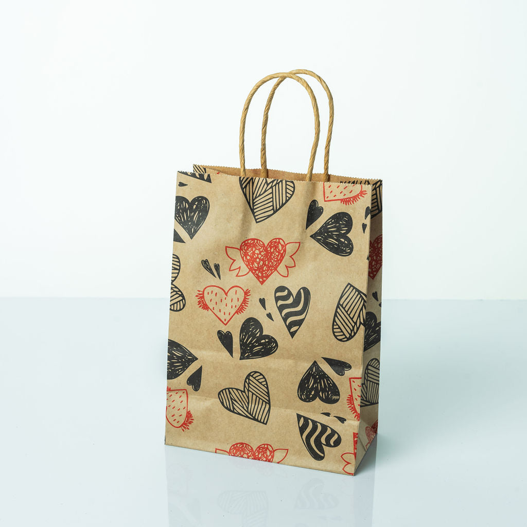 Sacs Kraft poignees torsadees motifs coeur L. 21 x 15cm