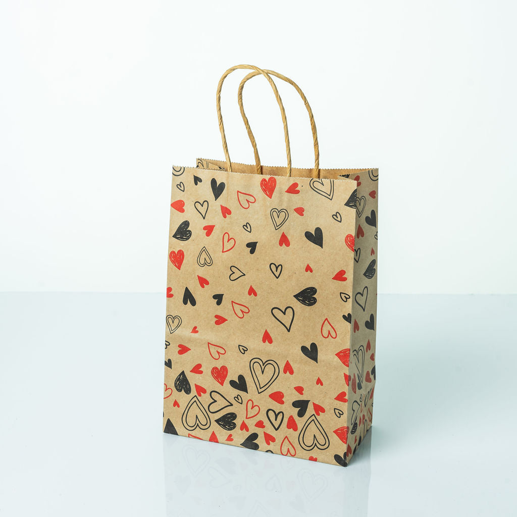 Sacs Kraft poignees torsadees motifs coeur L. 21 x 15cm