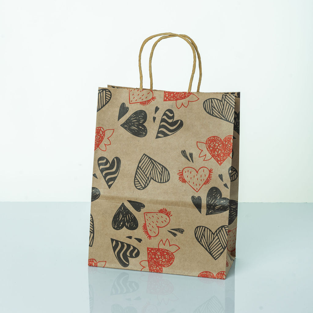 Sacs Kraft poignees torsadees motifs coeur L. 27 x 21cm