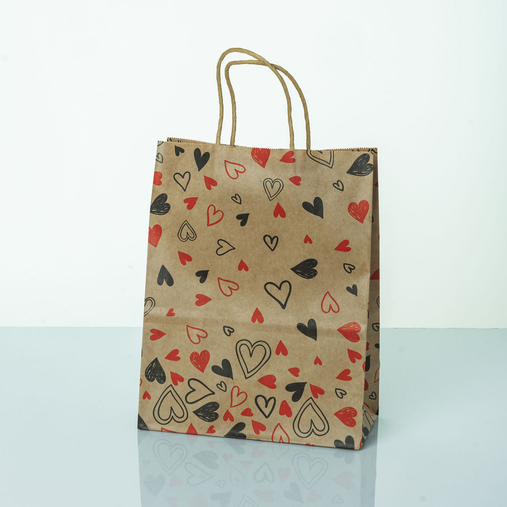 Sacs Kraft poignees torsadees motifs coeur L. 27 x 21cm