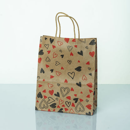 Sacs Kraft poignees torsadees motifs coeur L. 27 x 21cm