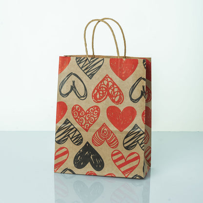 Sacs Kraft poignees torsadees motifs coeur L. 27 x 21cm