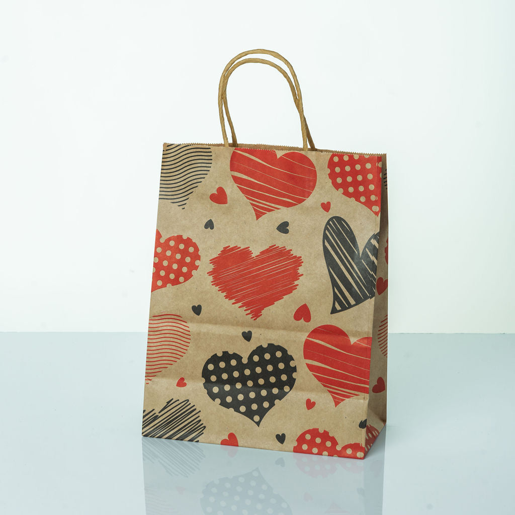 Sacs Kraft poignees torsadees motifs coeur L. 27 x 21cm