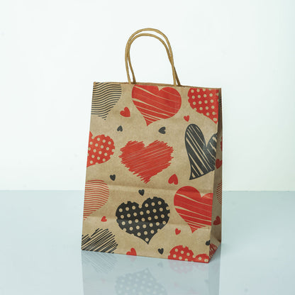 Sacs Kraft poignees torsadees motifs coeur L. 27 x 21cm